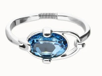 Bangle bracelet with faceted blue crystal
