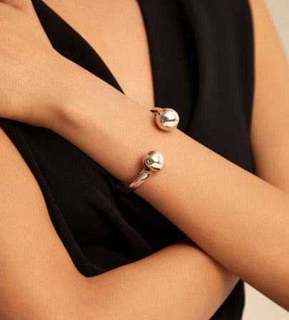 Bangle bracelet with double ball