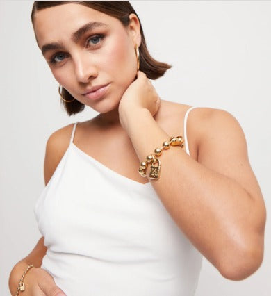 Beaded bracelet with a padlock charm